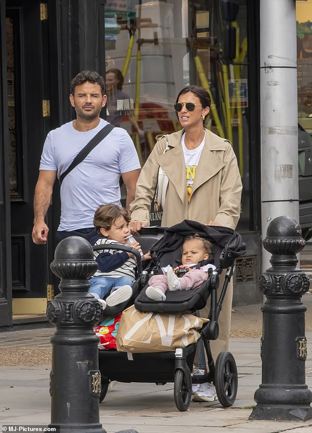 Out and about: Lucy Mecklenburgh, 32, looked stylish as she went shopping in Chelsea, London, on Friday with her fiancé Ryan Thomas, 39, and their two children