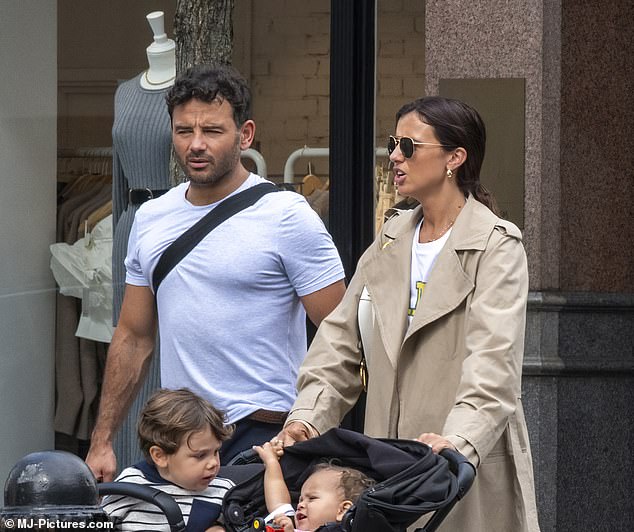 Walk: The former TOWIE star wore a chic beige trench coat, layered with a Ganni T-shirt and jeans