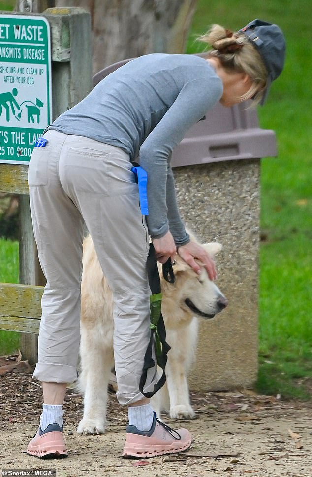 Love: The Hollywood movie star and her beloved golden retriever were seen petting and cleaning the fur while making sure he got plenty of exercise