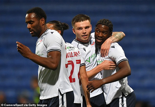 Nelson Khumbeni is congratulated for his team's seventh goal in Bolton's 8-1 win