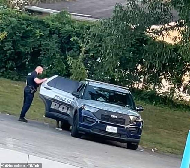 The officer follows the woman into the car