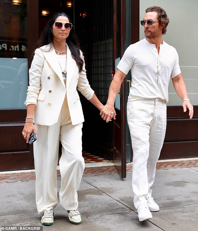 Color coordination: The mother of three also sported a monochrome look, wearing loose-fitting off-white trousers and a matching blazer