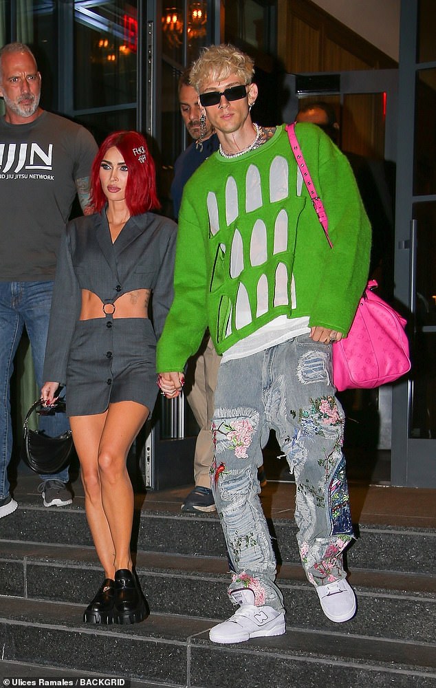 Colorful couple: Megan Fox, 37, and fiancé Machine Gun Kelly, 33, formed a colorful pair as they stepped out of New York City on Wednesday