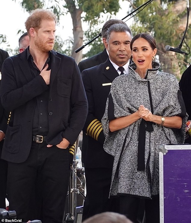 Meghan Markle was effortlessly chic in a monochrome statement coat as she attended a star-studded charity fundraiser in Santa Barbara last night