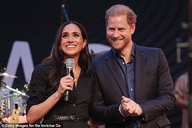 Delivering an emotional speech to 1,600 attendees, friends and family at a glittering party at the hotel in Dusseldorf, the Duchess of Sussex, 42, stunned in a black shirt dress from Banana Republic, costing £112