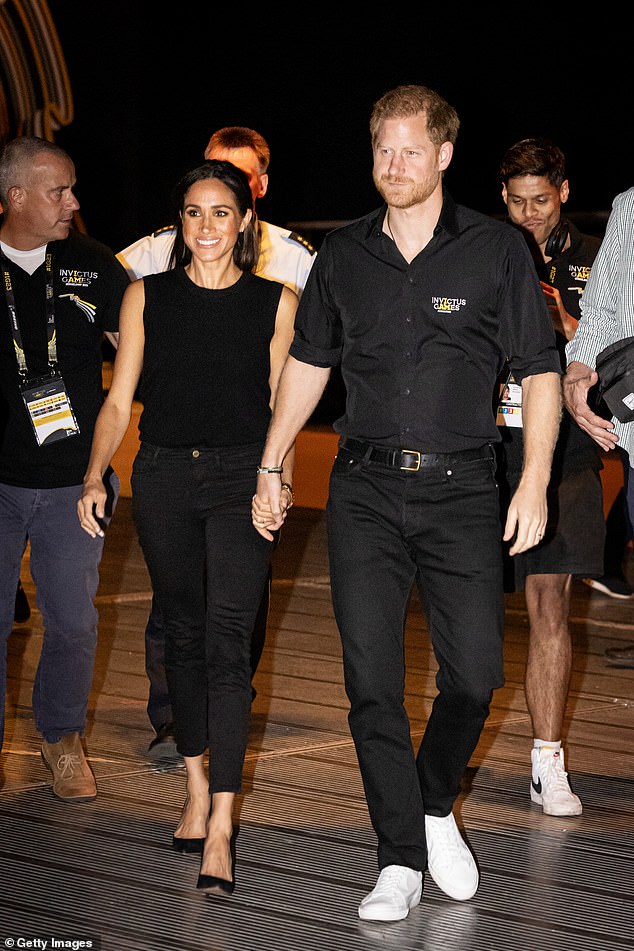 Meghan Markle opted for a series of monochrome outfits for the first day at the Invictus Games in Germany today