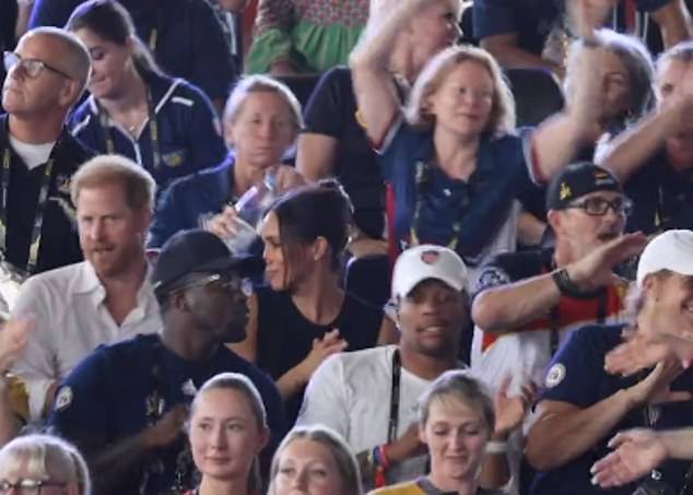 Prince Harry and Meghan Markle sang along to Sweet Caroline before watching the swimming final at the Invictus Games on Wednesday