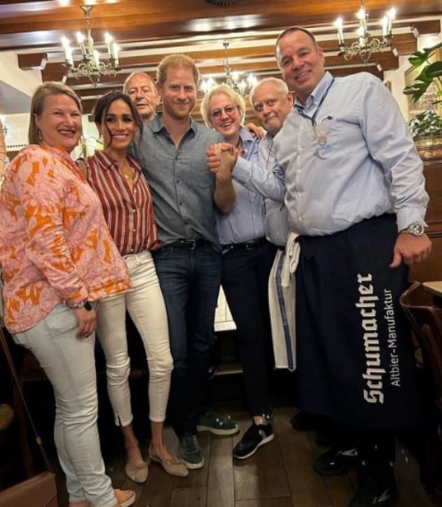 The Duchess of Sussex wore a structured red and white pinstripe shirt and her white jeans, plus beige pumps from Manolo Blahnik, as she celebrated Prince Harry's birthday at dinner