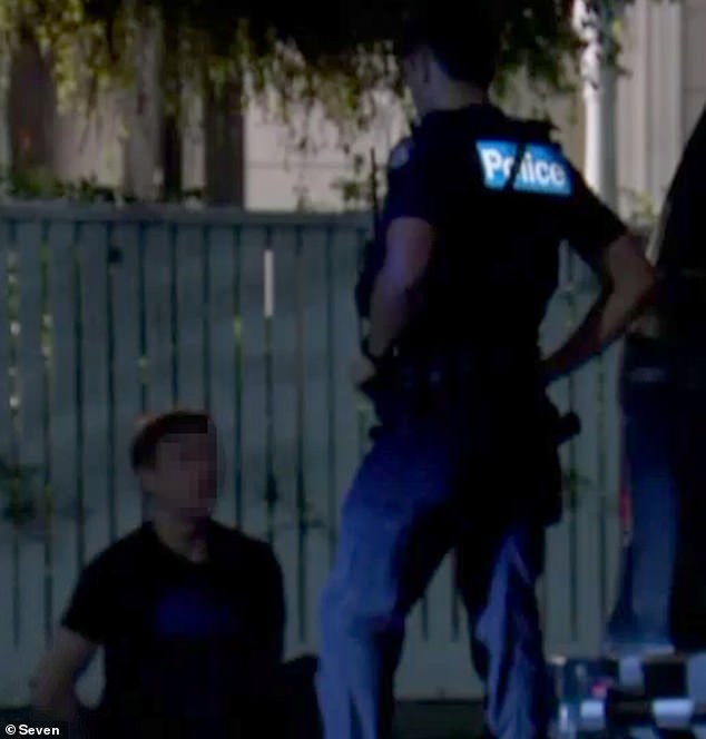 Five teenagers aged between 15 and 17 are currently being questioned by police over an aggravated burglary in Melbourne.  The photo shows one of the teens being arrested