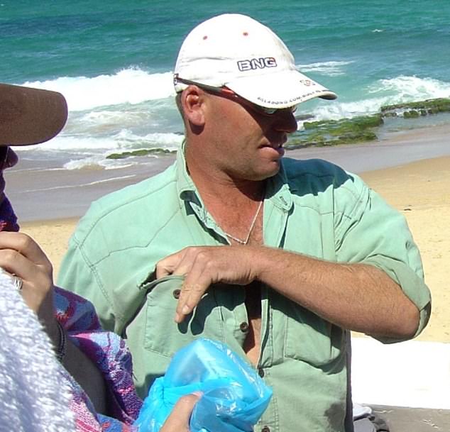 Former champion surfer Daniel Lowe (pictured), 49, is fighting for his life in hospital after being stabbed multiple times during a home invasion in Merewether, Newcastle