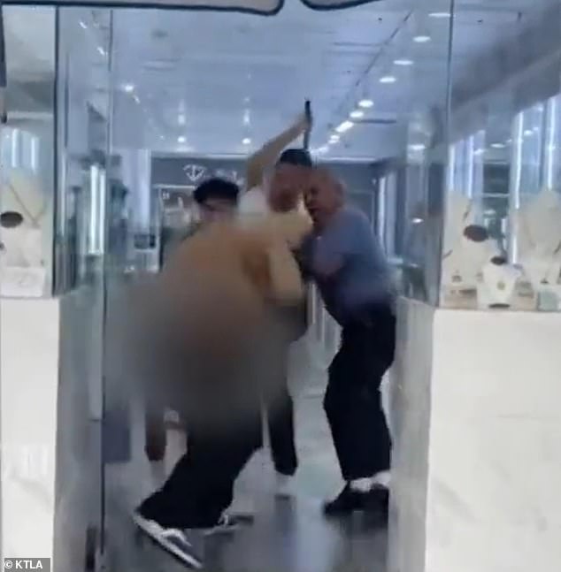 Video shows the moment an attempted thief was chased out of a California jewelry store after being beaten by employees he just sprayed