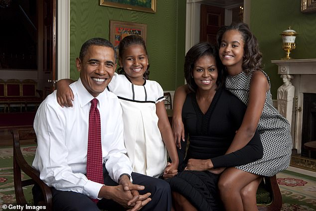 President Barack Obama at the start of his term in the White House with daughter Malia Obama, first lady Michelle Obama and daughter Sasha Obama in the Green Room of the White House, September 1, 2009