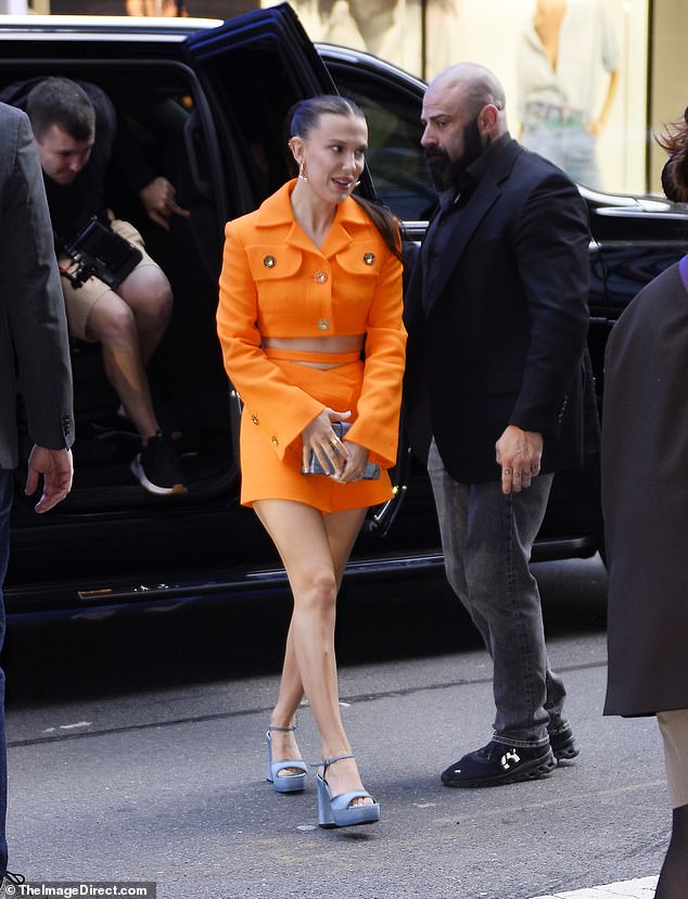 Millie Bobby Brown stuns in orange cropped blazer and skirt