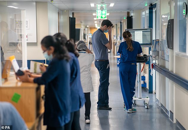 File photo dated January 18 this year, of a general view of staff on an NHS hospital ward