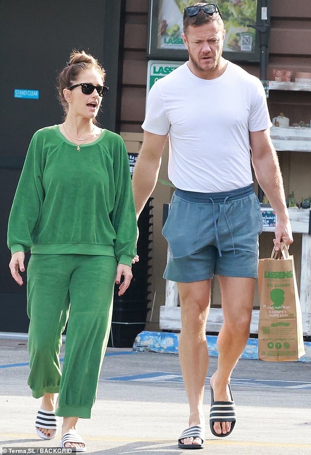 Looking fantastic: Minka Kelly popped up on a grocery run in Los Angeles this week with her beefcake boyfriend Dan Reynolds