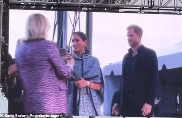 A clip on Santa Barbara Magazine's Instagram account shows the Duke and Duchess of Sussex taking the stage at the One805 Live!  event on Friday evening and Meghan reaches for the microphone