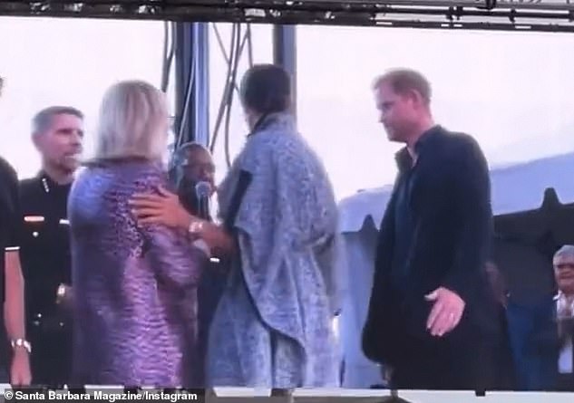 After realizing she has to present an award, the Duchess turns and quickly heads to the left