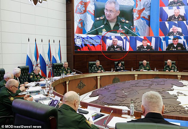 In a photo released by the Russian Ministry of Defense, Viktor Sokolov (circled) appears to take part in a video conference with Defense Minister Sergei Shoigu (main photo on video screen) and other top admirals and army leaders.