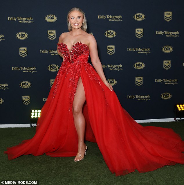 Purdy Watene-Zelezniak proved on Wednesday that she is more than capable of making a fashion statement.  Dallin Watene-Zelezniak's wife made sure all eyes were on her as she stepped out in a very leggy red dress for the Dally M Wards carpet in Sydney.  Pictured