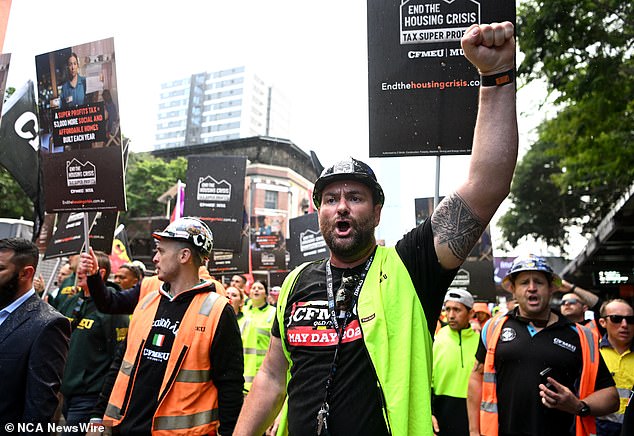 Despite the influx of population, Mr Minns said he supported record levels of immigration, arguing that more migrants were needed to build houses and apartments (pictured are workers from the Construction Forestry Maritime Mining and Energy Union in Brisbane who typically build apartments)