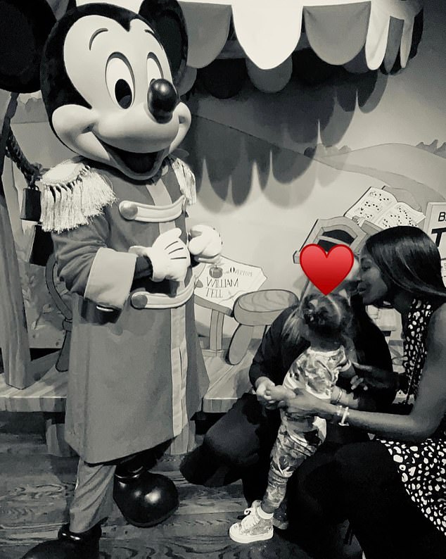 The model, pictured with her daughter at Disneyland, revealed she loves motherhood and describes it as 'great fun'