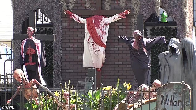 Vic Miorana's two-story Halloween display of a blood-stained Satan, Jesus, a nurse and a priest hanging from crosses has sparked outrage in New Orleans' Bucktown neighborhood