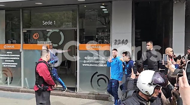 Lionel Messi waved to fans as he was spotted leaving a medical center in Argentina on Saturday