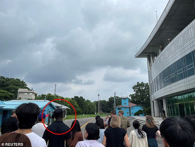 U.S. Army Private 2nd Class Travis King, circled, is pictured on the tour just before crossing the border into North Korea.  His hat was purchased in a gift shop in the demilitarized zone