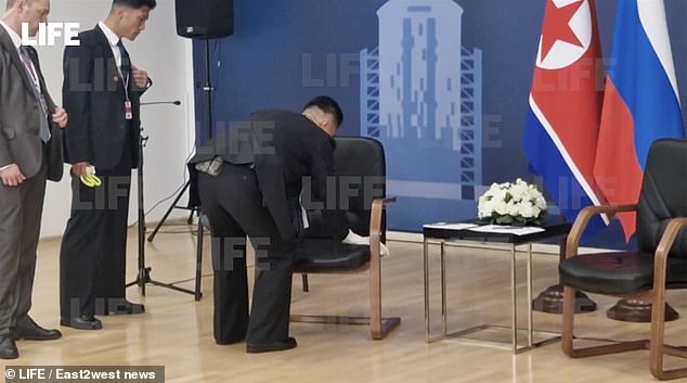 Kim Jong Un showed today that he does not fully trust fellow tyrant Vladimir Putin when some of his lackeys rigorously checked his seat ahead of their highly anticipated summit in Russia today (pictured)