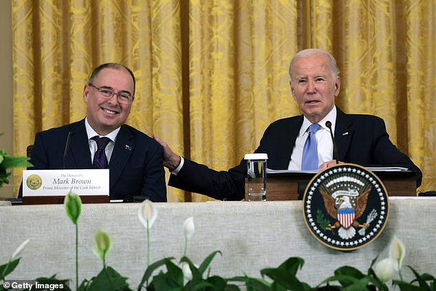 President Joe Biden (R) and Prime Minister of the Cook Islands Mark Brown participate in the Pacific Islands Forum (PIF) at the White House.  Biden stumbled over the acronym for an infrastructure initiative, but quickly moved on