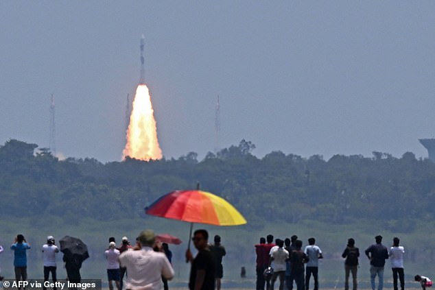 People watch as the PSLV XL rocket carrying the Aditya-L1 spacecraft launches Saturday from Satish Dhawan Space Center in Sriharikota