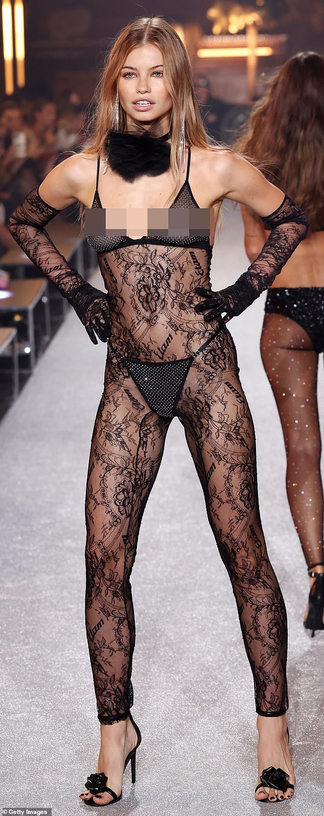 On the Etam catwalk for Paris Fashion Week, a model wore a striking, see-through lace catsuit