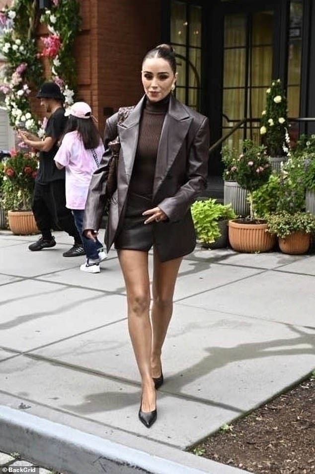 Autumn fashionista!  Olivia Culpo looked every bit the former Miss Universe she is as she left her Manhattan hotel to attend an event during New York Fashion Week