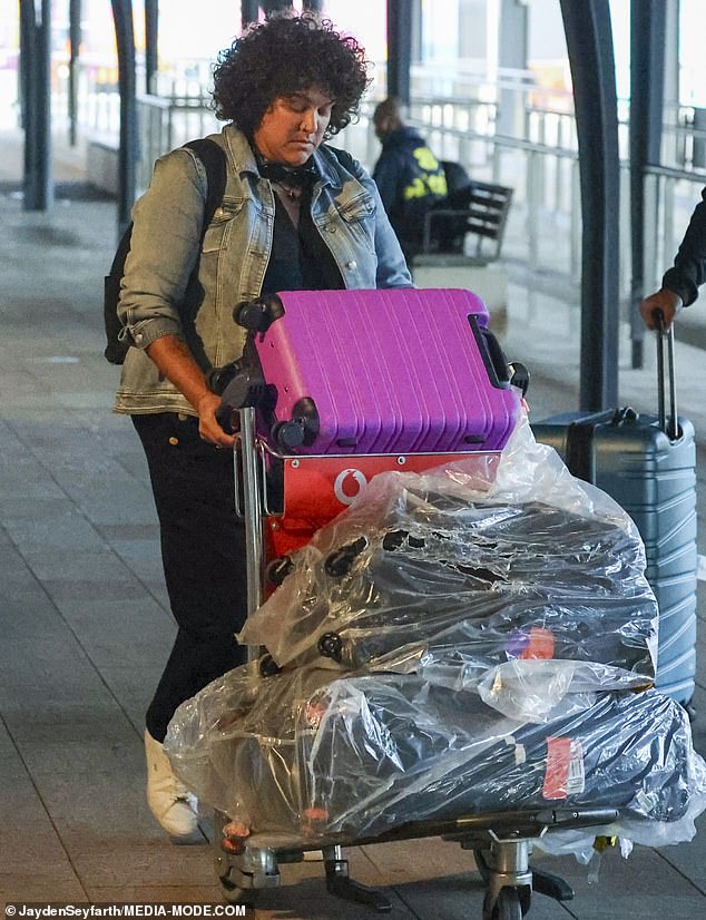 Casey Donovan flew into Sydney with a trolley full of luggage when she finally got home after being trapped at Burning Man for days