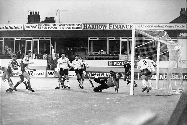 Arsenal striker Smith watches his header hit the net from a corner in 1990