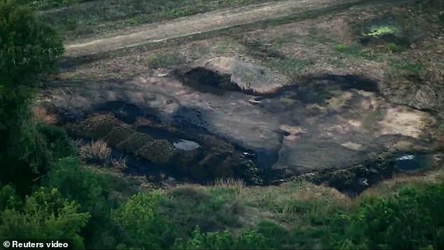 The scorched earth of the crashed fighter jet is visible in South Carolina on Monday