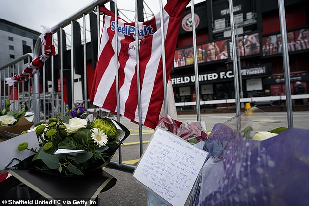 Flowers in memory of Sheffield United Women's player Maddy Cusack following her death last week