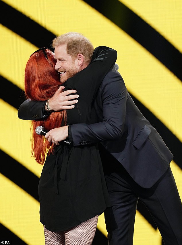 Prince Harry hugged Anna-Sofia Puzanova – the daughter of the Ukrainian war hero who was captured and tortured by Russian forces for 12 weeks yesterday during the Invictus Games in Dusseldorf, Germany