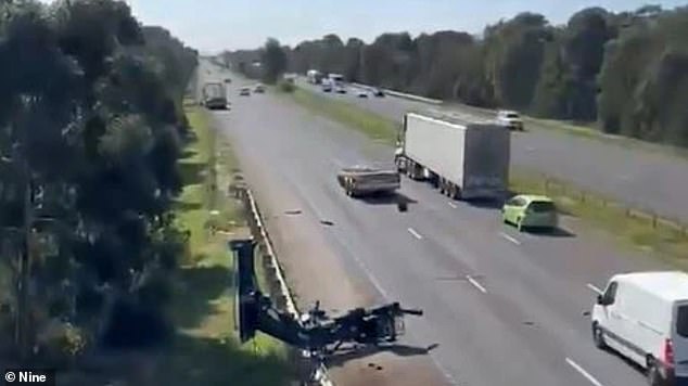 A truck has caused major delays on the Princes Freeway after crashing into an overpass (photo, debris left by truck)