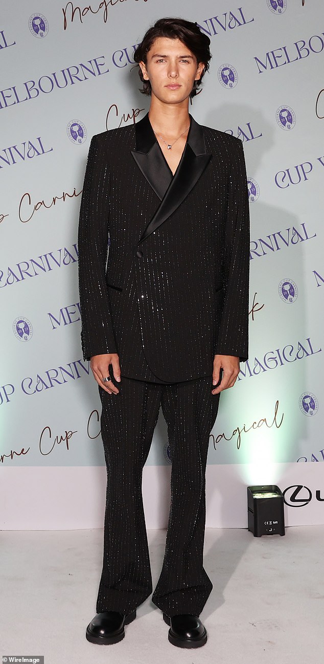 Nikolai, who was the guest of honor at the event, opted for a glittering pinstripe blazer and matching trousers for the occasion, completing the look with black boots.