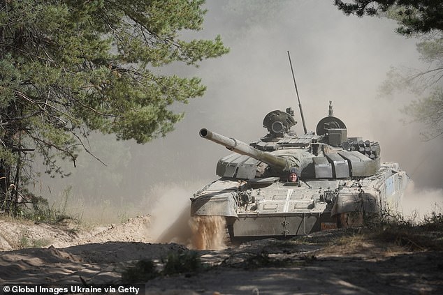 Lieutenant General Serhii Naiev, commander of the Joint Forces of the Armed Forces of Ukraine, pilots a captured Russian T72B3 tank during military exercises on September 8