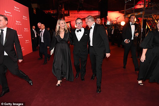 Qantas boss Alan Joyce abruptly left Qantas on Tuesday.  He is pictured with Prime Minister Anthony Albanese and his partner Jodie Haydon