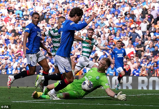 Sam Lammers goes around Celtic goalkeeper Joe Hart, but the Rangers man shot wide