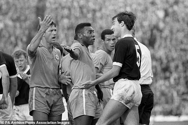 Scotland's Ronnie MacKinnon (right) takes on Brazilian legend Pele during a friendly ahead of the 1966 World Cup