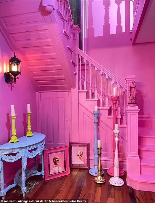 As soon as you step inside, you are greeted by a fuchsia pink staircase with framed photos of Barbie and Ken that set the tone for your visit