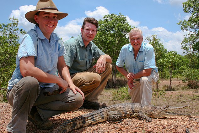 Adam Britton (centre) with his wife Erin (left) and David Attenborough (right) during filming for a BBC documentary Cold Blood