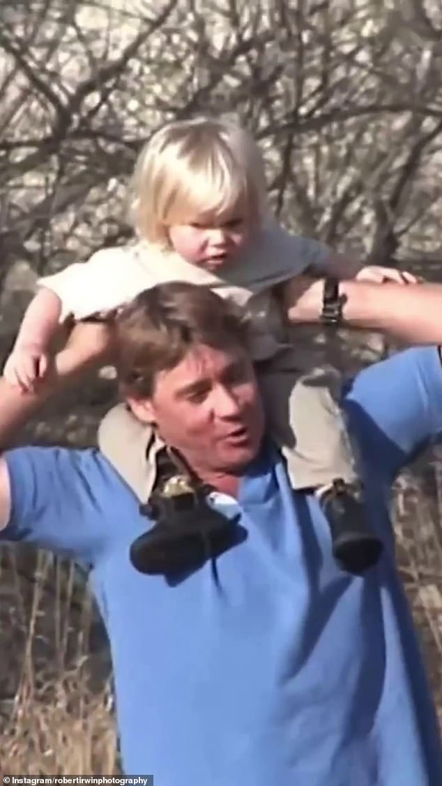 Robert Irwin led celebrity celebrations for Australian Father's Day on Sunday by sharing a never-before-seen video of him as a baby with his late father Steve.  Pictured: Steve with Robert Irwin in 2004, two years before his death