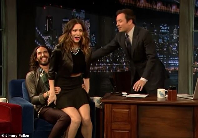 Resurfaced: Video footage of Russell Brand suggestively bouncing Katharine McPhee on his lap has been unearthed following bombing allegations