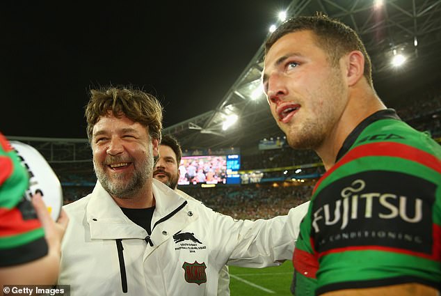 Crowe and Burgess celebrating in 2014 when the Souths skipper won the Clive Churchill Medal in the Bunnies' grand final over the Bulldogs, playing with a broken jaw