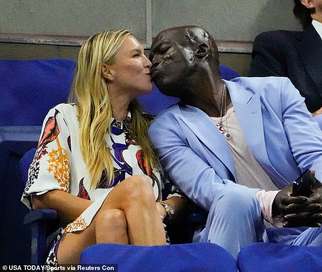 In love: Seal caught on the PDA with his assistant girlfriend Laura Strayer on day six of the 2023 US Open tennis tournament on Sunday